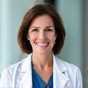 Dr. Sarah Mitchell, smiling professional portrait.